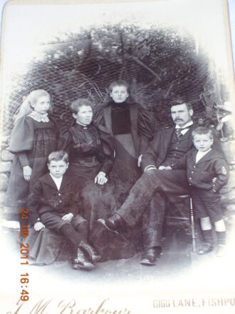 Reginald with his family. He is the youngest boy.